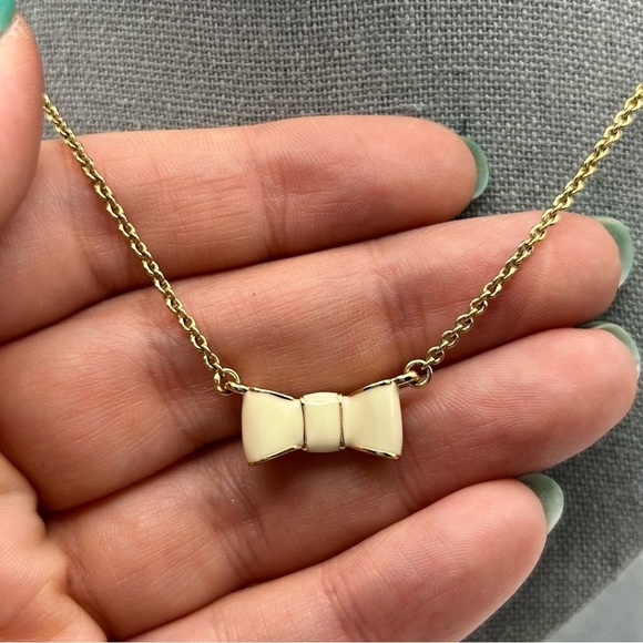 Kate Spade Gold Tone Chain with White Enamel Bow Ribbon Charm Short Necklace 19" - Picture 3 of 10